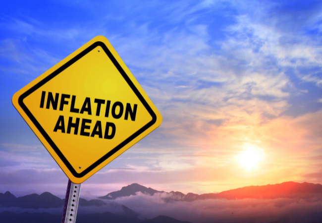 Immagine di un cartello con scritto "INFLATION AHEAD".