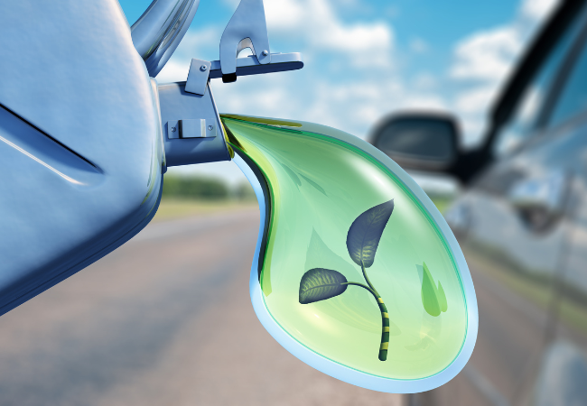 Immagine di un goccia verde con all'interno una foglia che fuoriesce da una tanica come a indicare biocarburante.