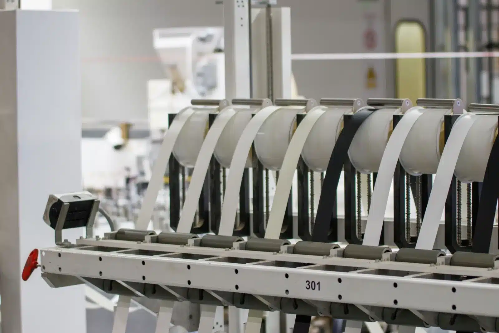 Modern industrial machine in operation in a manufacturing facility showcasing advanced technology.