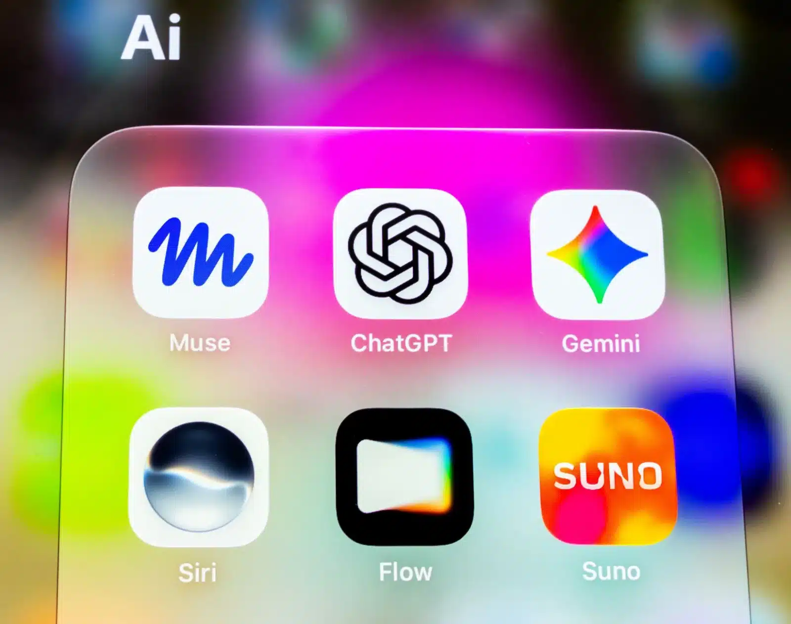 Colorful close-up of AI app icons on a smartphone screen featuring Muse, ChatGPT, Gemini, Siri, Flow, and Suno.